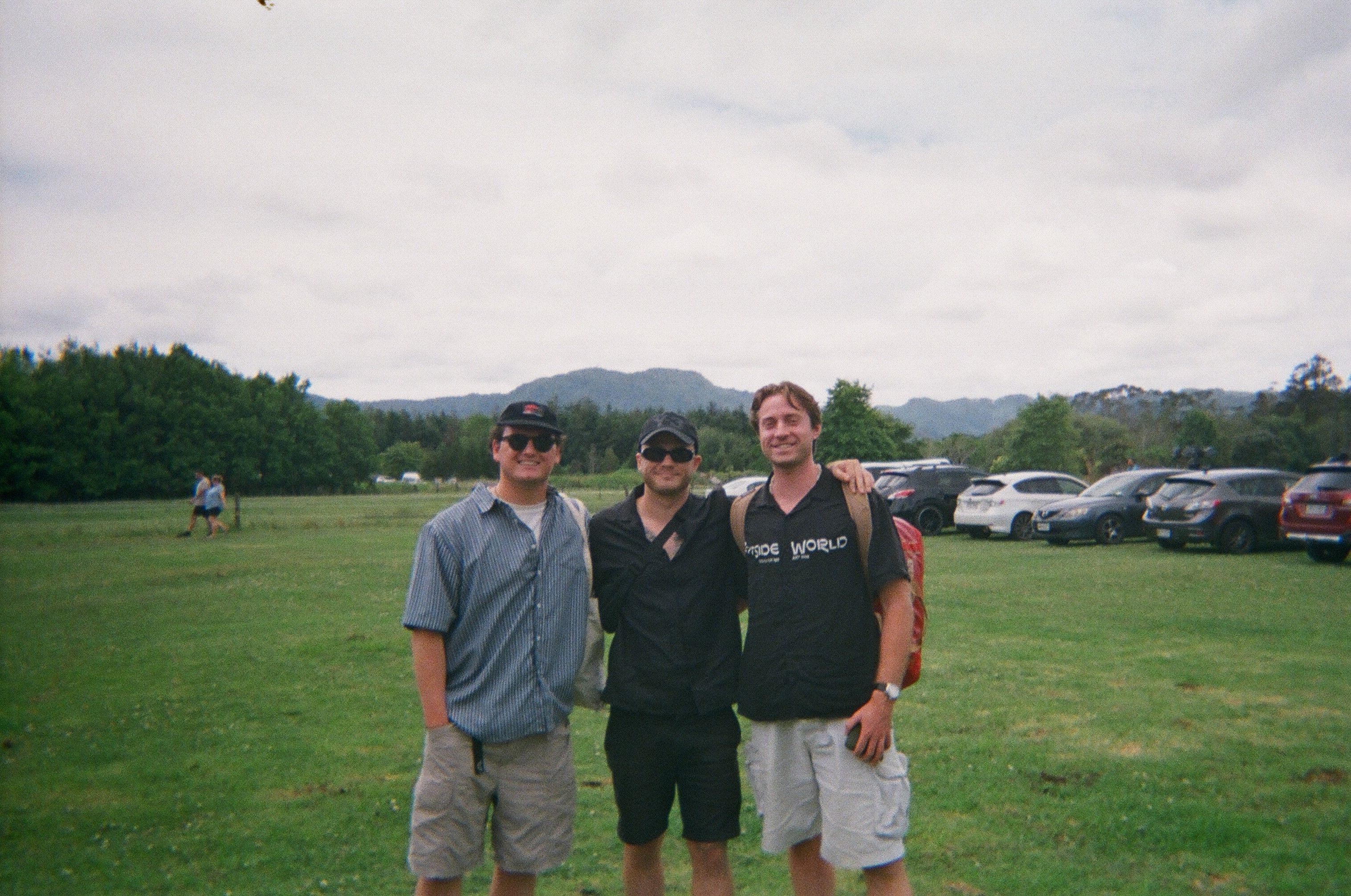Three happy dudes in a field