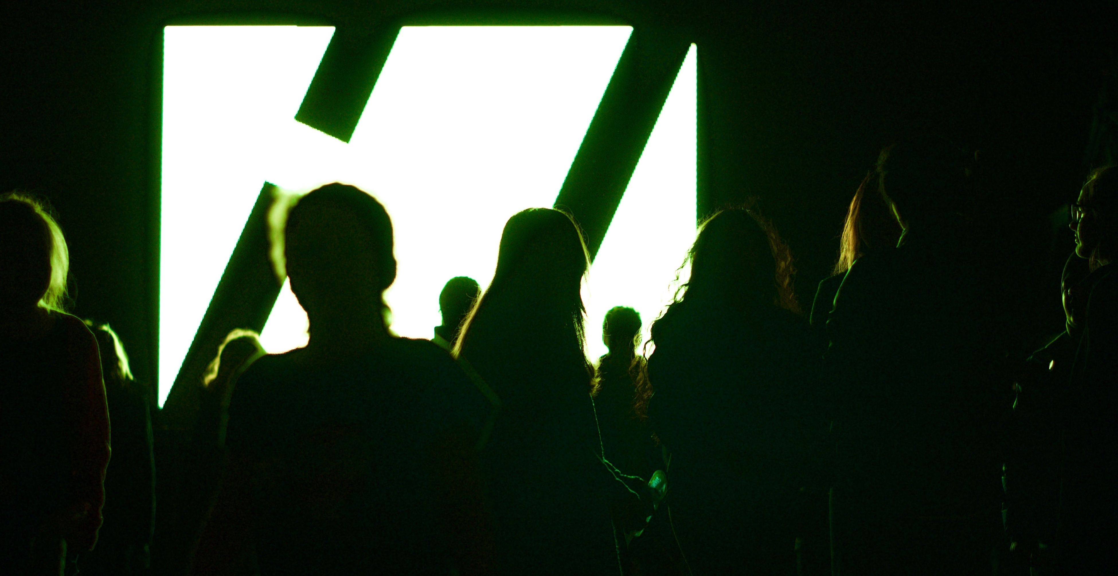 dark silhouettes lit up in green